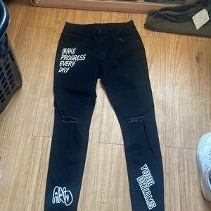 black romwe jeans ripped at kneecaps